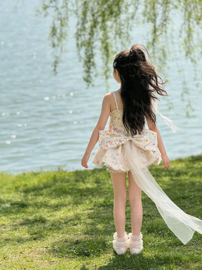 Vestido de tirantes floral para niñas, pantalones cortos con diseño de capullo de flor, vestido de princesa estilo occidental para verano 2026, falda esponjosa con lazo y cola de hilo para niñas
