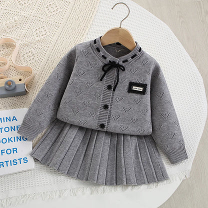 Conjunto para niñas 2025, Otoño Invierno, nuevo suéter gris de punto de manga larga, Falda plisada, conjunto de dos piezas para bebé a la moda